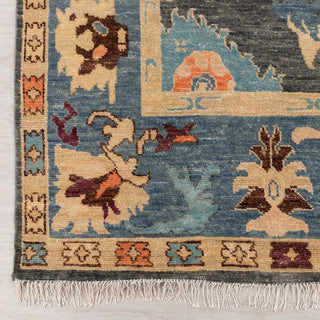 Modern hand-knotted rug with colorful Oushak-inspired pattern in teal, camel, rust, multicolor accents.