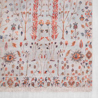 Modern hand-knotted rug with delicate linear floral pattern in soft ivory, rust, and grey.