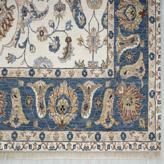 Modern hand-knotted rug with flowing arabesque floral pattern on ivory field and rich blue border accents, 9x12 ft