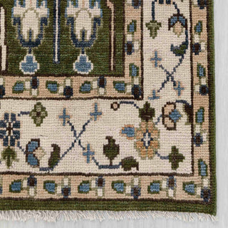 Modern hand-knotted rug with intricate botanical pattern in olive green, ivory accents, classic living room size.