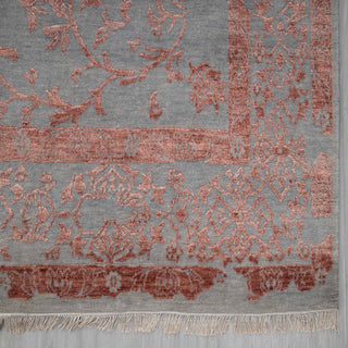 Modern hand-knotted rug with linear grey field and intricate pink floral overlay, ideal for chic living or bedroom decor