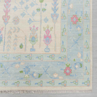 Modern hand-knotted rug with linear tree-of-life pattern in ivory field and soft blue border, 8x10 area