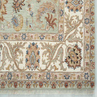 Modern hand-knotted rug with open floral pattern in seafoam green tones, 9x12 ft wool.