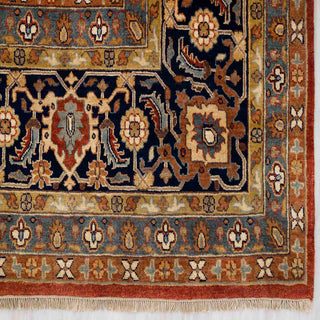 Modern hand-knotted rug with rich rust background and navy floral border, durable wool 10x14 living room carpet.
