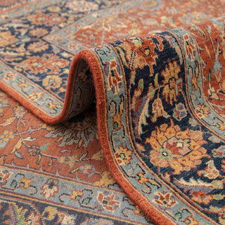 Modern hand-knotted rug with richly patterned rust ground and navy floral border, durable wool 6x9 living room carpet