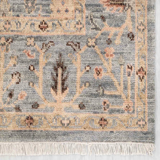 Modern hand-knotted rug with soft botanical pattern in misty grey and warm neutrals, 8x10.