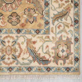 Modern hand-knotted rug with soft curvilinear Persian-inspired pattern in beige, gold, muted blue