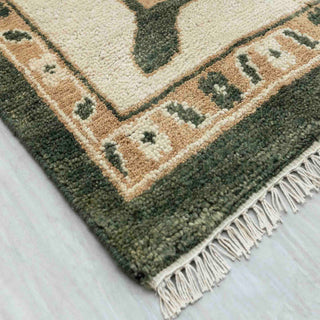 Modern hand-knotted rug with traditional green Oushak pattern and ivory border, ideal for elegant classic interiors
