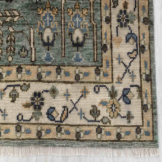 Modern hand-knotted rug with vertical tree-of-life pattern in teal, cream, blue accents, 8x10