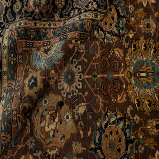 Modern hand-knotted wool area rug with detailed floral pattern in warm brown, beige, and blue, ideal 8x10 size