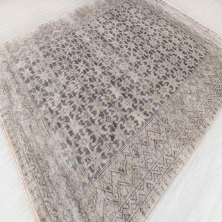 Moroccan-style hand-knotted rug with tonal tribal motif in warm grey and stone neutrals