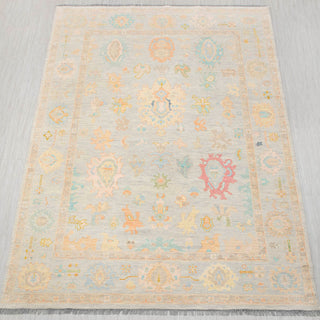 Oushak-style hand-knotted rug in light grey with soft pastel floral medallion design, 10x14