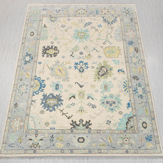 Oushak-style hand-knotted rug in ivory and light blue with floral medallion design, 10x14.