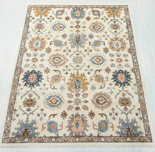 Oushak-style hand-knotted rug in ivory, blue, gold with floral medallion design, 8x10.