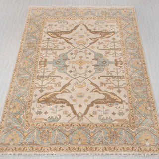 Oushak-style hand-knotted rug in ivory, gold, aqua with soft floral design, 8x10
