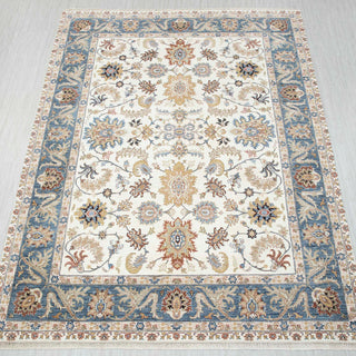Oushak-style hand-knotted rug in ivory, sky blue, gold, terracotta with floral vine design, 9x12 ft