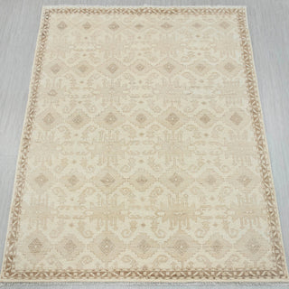 Oushak hand-knotted rug in ivory and beige with subtle geometric pattern, ideal neutral 9x12.