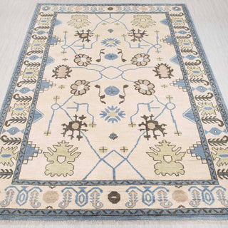 Oushak hand-knotted rug in ivory, blue, green with floral tribal design, 9x12 area size.