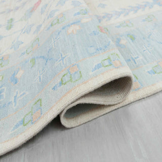 Pastel blue tree-of-life wool rug, low pile 8x10 carpet ideal for kids rooms, nurseries, bright living rooms