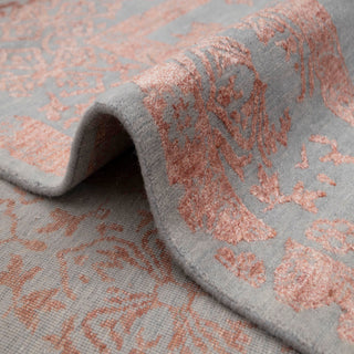 Persian-inspired hand-knotted rug with overdyed pink vine motif on light grey ground, elegant oriental style, large 8x10.