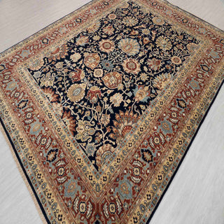 Persian-style Ziegler hand-knotted rug with intricate floral motifs in navy, rust, gold, 9x12