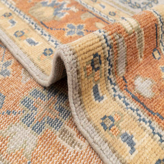 Persian-style hand-knotted rug in cream rust orange with vine tree design. Large 12x15 ft living room rug