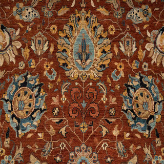 Persian-style hand-knotted rug in rust, navy, and blue with dense floral design, 10x14 ft