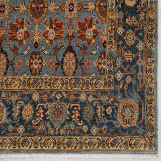 Persian-style hand-knotted rug with allover floral motifs in blue, camel, and terracotta, room-size 6x9 area