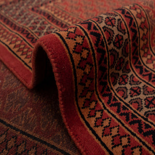 Persian-style hand-knotted rug with classic boteh motif in red, rust, and dark brown, 6x9 carpet.