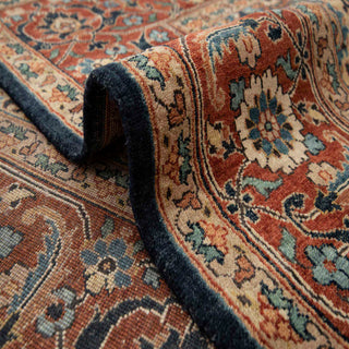 Persian-style hand-knotted rug with intricate floral motifs in navy, rust, and gold tones, ideal 8x10 area rug