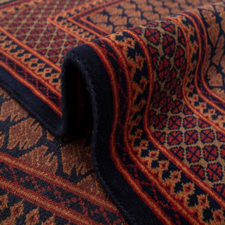 Persian-style hand-knotted rug with repeating boteh motif in rust and burgundy on navy, 6x9.