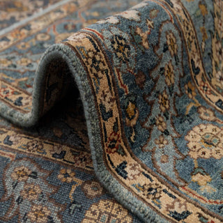 Persian-style hand-knotted rug with small medallion and floral motifs in blue, tan, and burgundy, compact 4x6 area