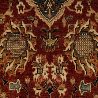 Persian-style hand-knotted wool rug with classic allover floral motifs in rich rust and black tones.