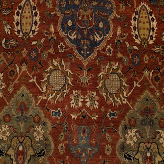 Persian-style hand-knotted wool rug with classic allover floral motifs in rich rust and black tones.