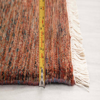 Persian Gabbeh-style hand-knotted runner with tribal solid motif in rust, terracotta, gray tones.