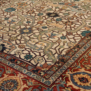 Persian Heriz-style hand-knotted rug with allover geometric motifs in ivory, rust, blue