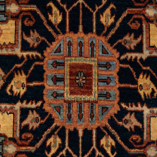 Persian Heriz Serapi style hand-knotted rug with bold central medallion motif in rust, navy, gold and ivory