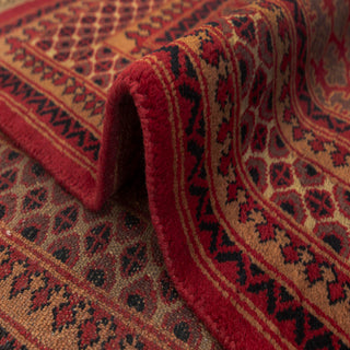 Persian/Indian Gabbeh hand-knotted rug with boteh motifs and tribal borders in red, olive, rust, camel