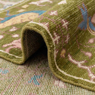 Persian paradise garden hand-knotted rug with animal and bird motifs in olive, blue, pink and gold