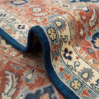 Persian-style Ziegler hand-knotted rug with intricate floral motifs in navy, rust, gold 10x14