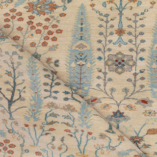 Persian style hand-knotted rug with soft ivory garden and cypress motifs in sky blue, taupe and terracotta.