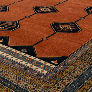 Persian tribal-style hand-knotted ivory wool rug with repeating diamond medallion motif, 8x10 size