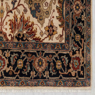 Agra-style hand-knotted rug with classic floral motifs in ivory, navy, rust, and blue, medium 5x7 area.
