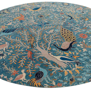Round hand-knotted rug in teal and multicolor with Tree-of-Life bird design