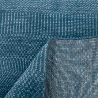 Scandinavian-style hand-knotted runner with minimalist stripe motif in tonal blue shades.

