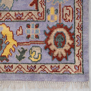 Soft wool 8x10 living room rug, purple field, colorful motifs, low pile, boho statement carpet.
