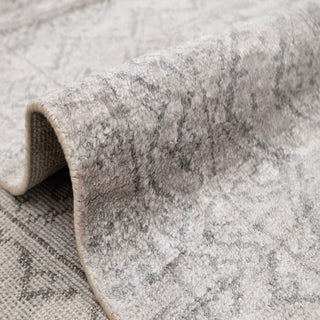 Soft wool 8x10 living room rug, neutral grey field, low-contrast pattern, versatile and elegant.