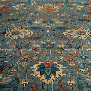 Sultanabad-inspired hand-knotted rug with floral palmette motif in muted blue and warm accent tones
