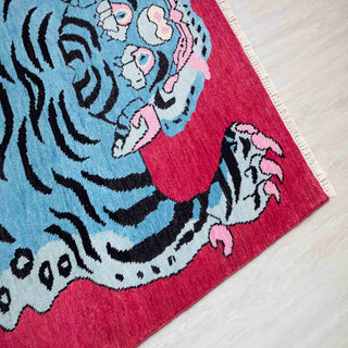 Tibetan tiger hand-knotted rug with bold animal motif in blue, black, pink, 5x7 living room size