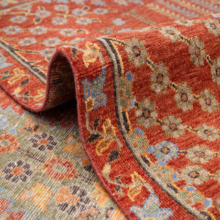 Traditional Persian style hand-knotted rug with chahar bagh garden and pavilion motifs in warm terracotta tones.